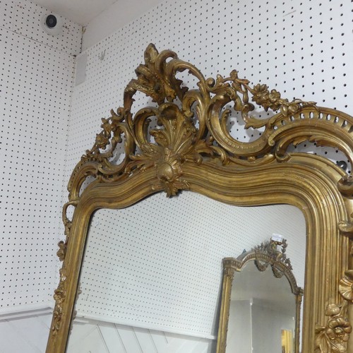 507 - A large 19th century French style gilt framed wall Mirror, the crest with central carved acanthus le... 