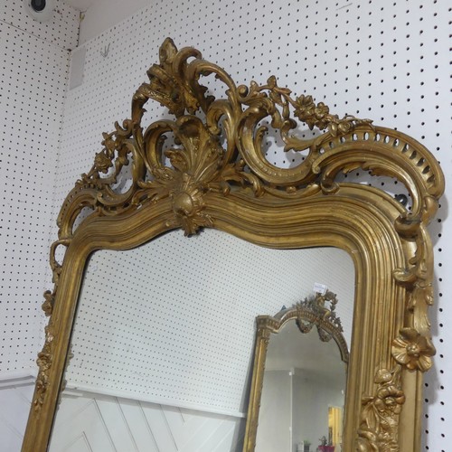 507 - A large 19th century French style gilt framed wall Mirror, the crest with central carved acanthus le... 