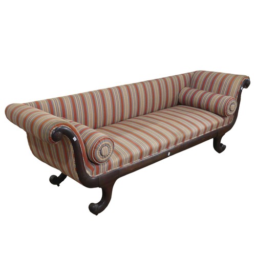 A Regency mahogany scroll-end Sofa, of rectangular proportions, raised on four scroll sabre legs, upholstered in later striped fabric, complete with two cushions, W 212 cm x H 71 cm x D 62 cm.