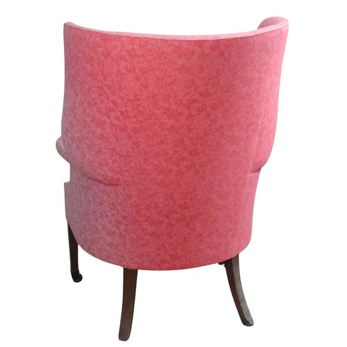 510 - An antique wing-back Armchair, upholstered in pink, raised on tapering front legs with castors and r... 