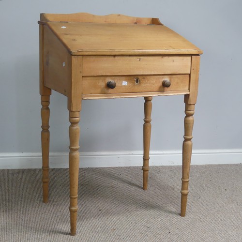 514 - An antique pine clerks Desk, sloped fall front above single drawer, raised on four turned supports, ... 