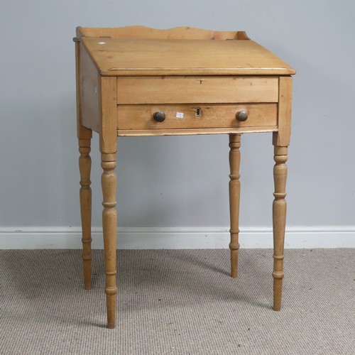 514 - An antique pine clerks Desk, sloped fall front above single drawer, raised on four turned supports, ... 