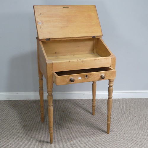 514 - An antique pine clerks Desk, sloped fall front above single drawer, raised on four turned supports, ... 