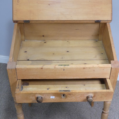 514 - An antique pine clerks Desk, sloped fall front above single drawer, raised on four turned supports, ... 