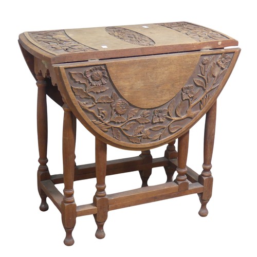 515 - An Anglo-Chinese style drop-leaf gate-leg Table, oval top with carved foliate border and central dra... 