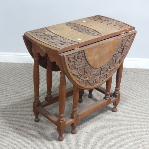 515 - An Anglo-Chinese style drop-leaf gate-leg Table, oval top with carved foliate border and central dra... 