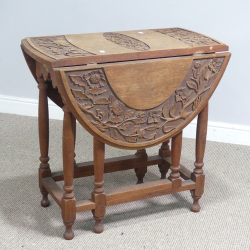 515 - An Anglo-Chinese style drop-leaf gate-leg Table, oval top with carved foliate border and central dra... 