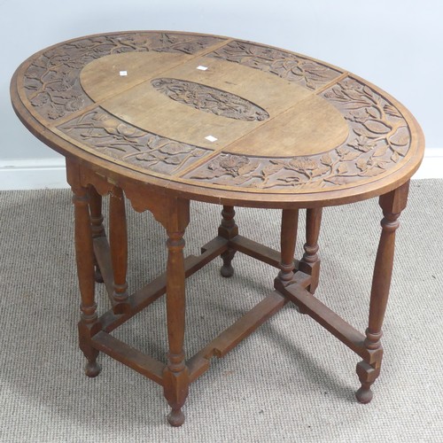 515 - An Anglo-Chinese style drop-leaf gate-leg Table, oval top with carved foliate border and central dra... 