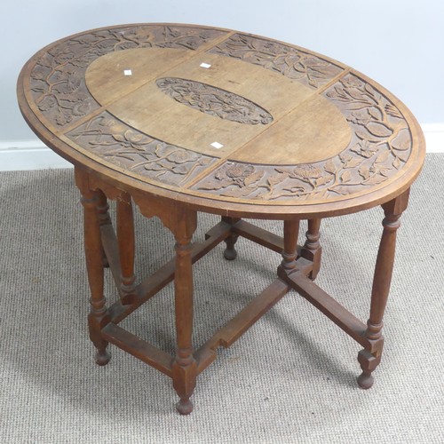 515 - An Anglo-Chinese style drop-leaf gate-leg Table, oval top with carved foliate border and central dra... 