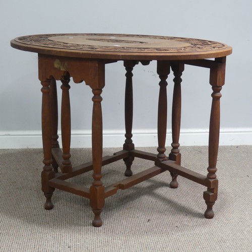 515 - An Anglo-Chinese style drop-leaf gate-leg Table, oval top with carved foliate border and central dra... 