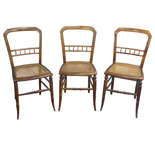 518 - A set of three Edwardian possibly beech cane seated bedroom Chairs, with turned spindle bar backs, W... 