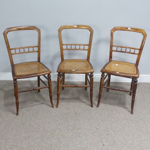 518 - A set of three Edwardian possibly beech cane seated bedroom Chairs, with turned spindle bar backs, W... 