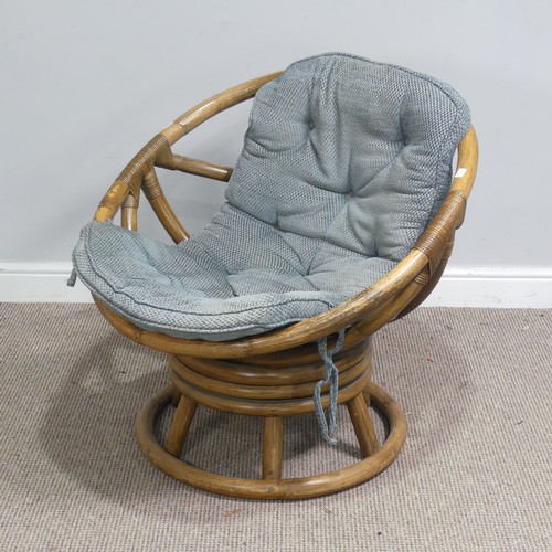 411 - A mid-20th century bentwood bamboo swivel Chair, with blue cushion, W 74.5 cm x H 71 cm x D 65 cm to... 