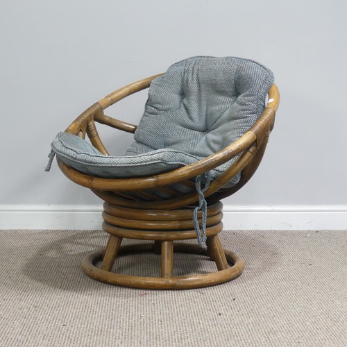 411 - A mid-20th century bentwood bamboo swivel Chair, with blue cushion, W 74.5 cm x H 71 cm x D 65 cm to... 