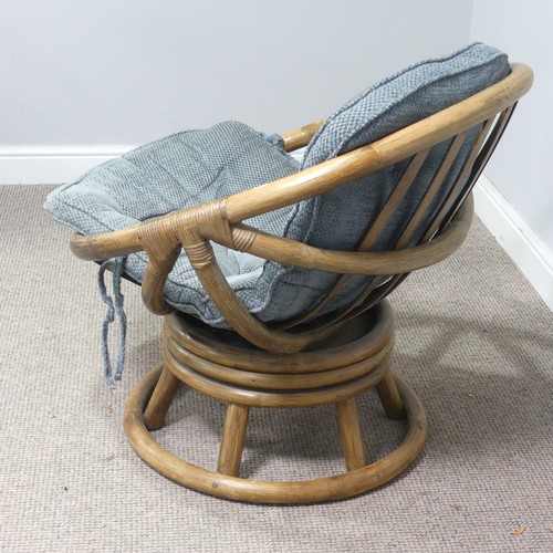 411 - A mid-20th century bentwood bamboo swivel Chair, with blue cushion, W 74.5 cm x H 71 cm x D 65 cm to... 