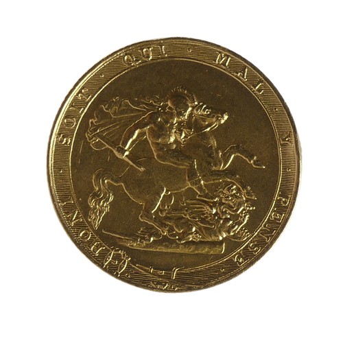 427 - A George III gold Sovereign, dated 1818, ex-mount, the obverse with solder residue and associated ma... 