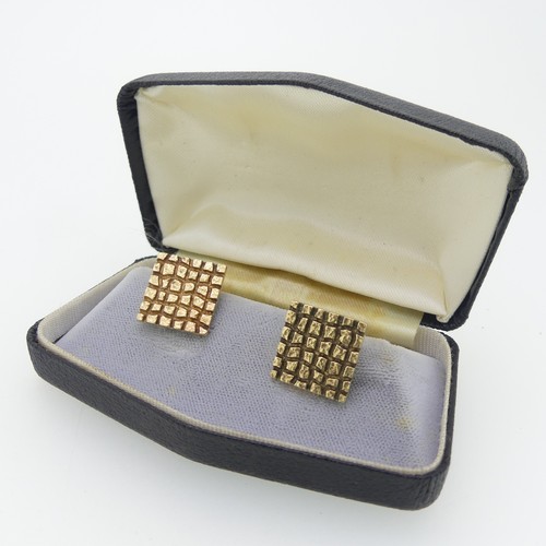 361 - A cased pair of 9ct yellow gold Cufflinks, hallmarked London, 1966, the textured chequerboard square... 