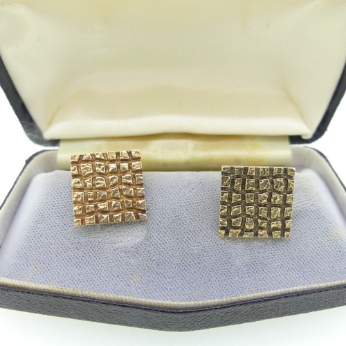 361 - A cased pair of 9ct yellow gold Cufflinks, hallmarked London, 1966, the textured chequerboard square... 