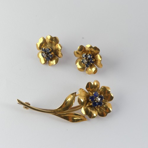 331 - A foliate Brooch and Earring suite, the flowerheads set with five sapphires and central diamond poin... 