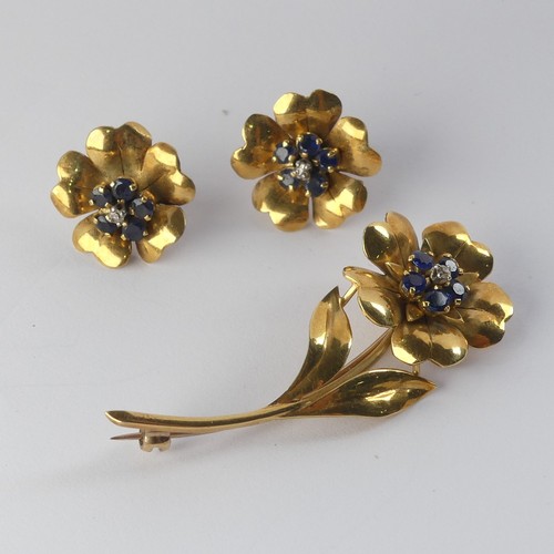 331 - A foliate Brooch and Earring suite, the flowerheads set with five sapphires and central diamond poin... 