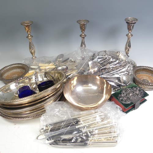 65 - A quantity of Silver Plate, including a pair of candlesticks, entree dishes, bottle coaster, flatwar... 