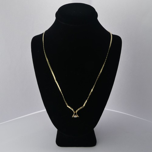 312 - A 9ct yellow gold Pendant, set small diamond point, on an integral chain with box clasp, 42cm long, ... 