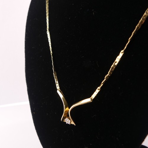 312 - A 9ct yellow gold Pendant, set small diamond point, on an integral chain with box clasp, 42cm long, ... 