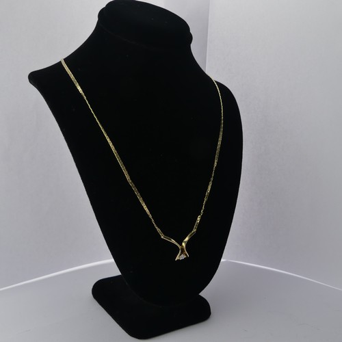 312 - A 9ct yellow gold Pendant, set small diamond point, on an integral chain with box clasp, 42cm long, ... 