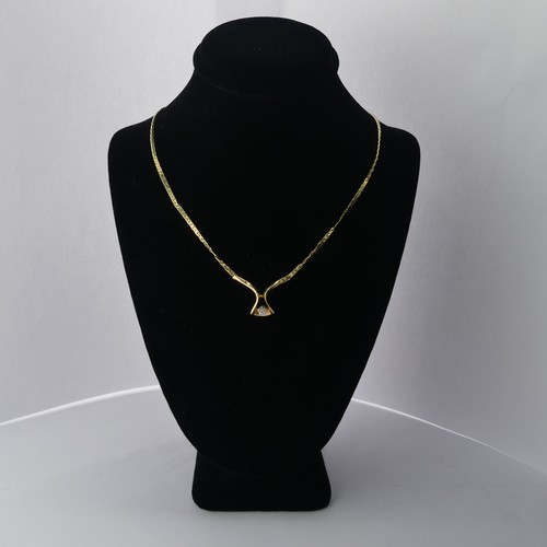 312 - A 9ct yellow gold Pendant, set small diamond point, on an integral chain with box clasp, 42cm long, ... 