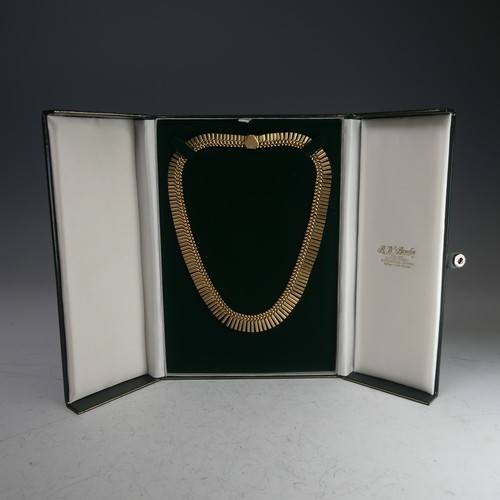 313 - A 9ct yellow gold fringe 'Cleopatra' Necklace, hallmarked Birmingham, 1967, the clasp with inscripti... 