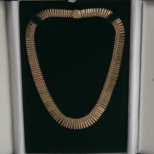 313 - A 9ct yellow gold fringe 'Cleopatra' Necklace, hallmarked Birmingham, 1967, the clasp with inscripti... 