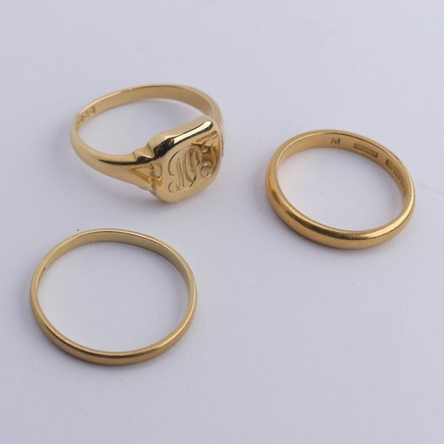 277 - A narrow 22ct yellow gold Band, Size Q, 4.2g together with an 18ct gold signet ring, engraved with i... 