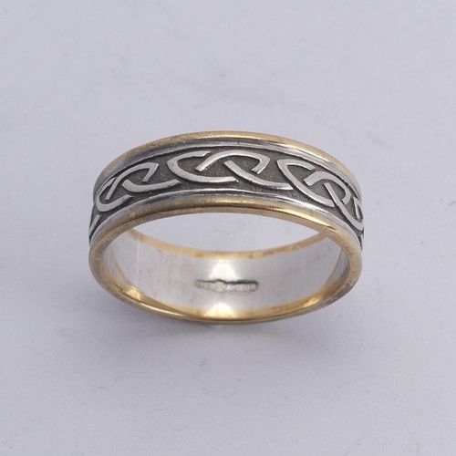 279 - An Irish two colour 10ct gold Band, with Celtic decoration, Size Y, 8.4g.