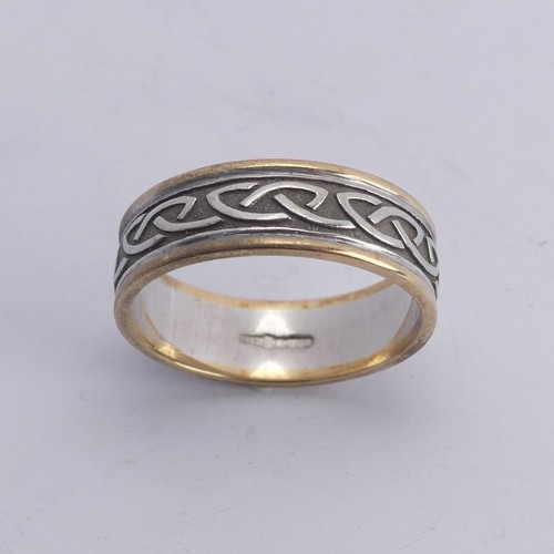 279 - An Irish two colour 10ct gold Band, with Celtic decoration, Size Y, 8.4g.