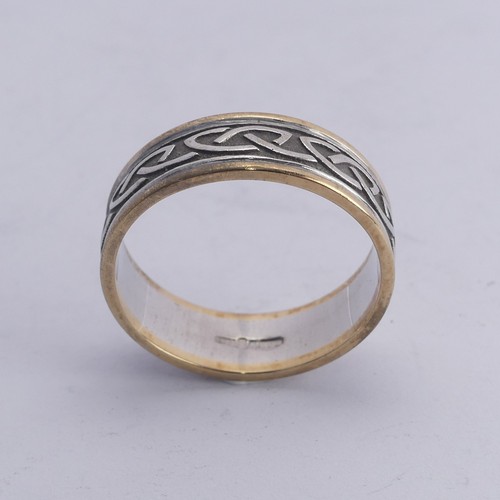 279 - An Irish two colour 10ct gold Band, with Celtic decoration, Size Y, 8.4g.