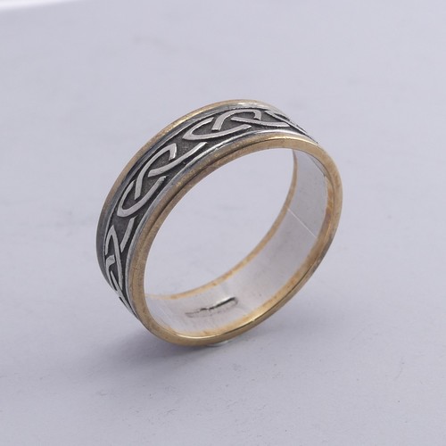 279 - An Irish two colour 10ct gold Band, with Celtic decoration, Size Y, 8.4g.