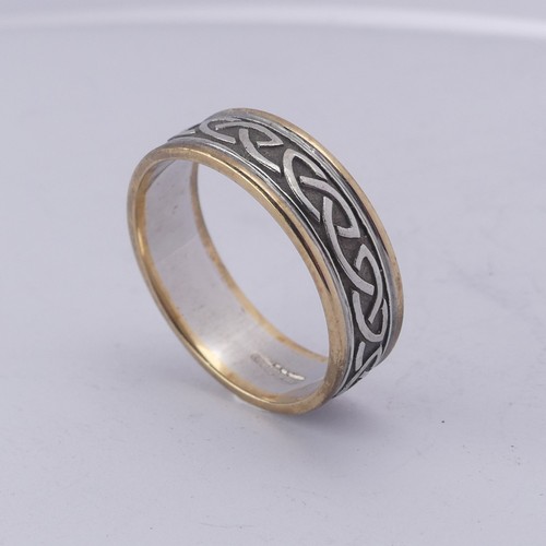 279 - An Irish two colour 10ct gold Band, with Celtic decoration, Size Y, 8.4g.