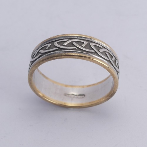 279 - An Irish two colour 10ct gold Band, with Celtic decoration, Size Y, 8.4g.