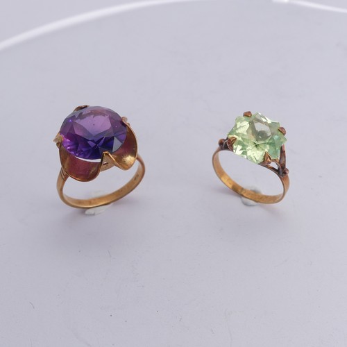 280 - A synthetic sapphire Ring, the colour change circular facetted stone approx. 13.75mm diameter, mount... 