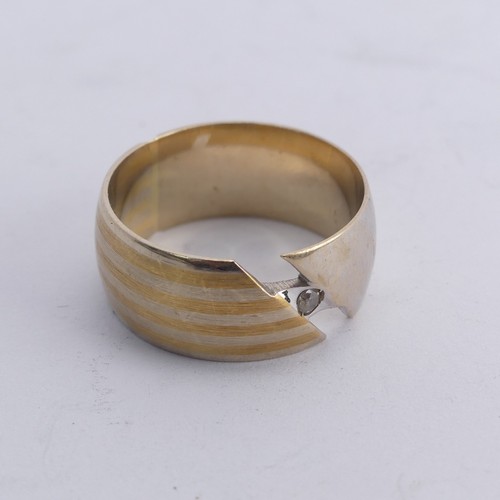 281 - A 14ct gold Band, the abstract split front with single white paste, Size N, 6.8g.