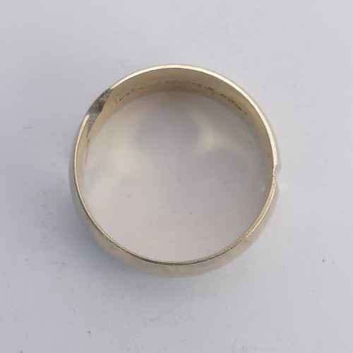 281 - A 14ct gold Band, the abstract split front with single white paste, Size N, 6.8g.