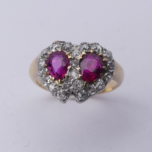 A late Victorian ruby and diamond cluster Ring, formed as two entwined hearts, central pear shaped rubies, approx. 5.6mm long, surrounded by old cut diamonds, the cluster 14.7mm wide, yellow gold shank unmarked, tested as 18ct, Size L, 5.2g.