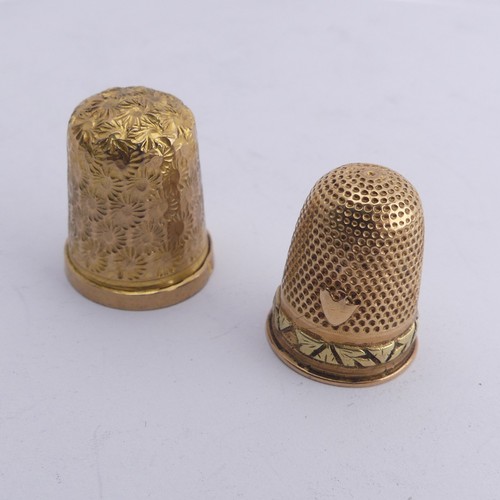 368 - A 9ct gold Thimble, with foliate engraved decoration, 20mm high, together with another unmarked in t... 