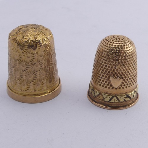 368 - A 9ct gold Thimble, with foliate engraved decoration, 20mm high, together with another unmarked in t... 