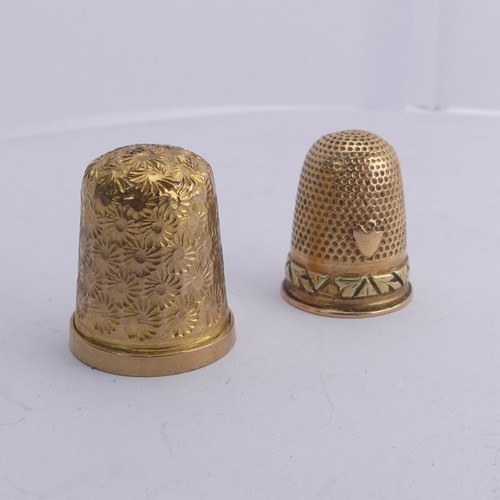 368 - A 9ct gold Thimble, with foliate engraved decoration, 20mm high, together with another unmarked in t... 