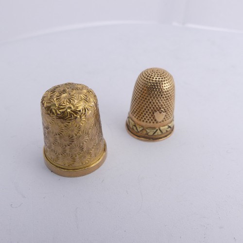 368 - A 9ct gold Thimble, with foliate engraved decoration, 20mm high, together with another unmarked in t... 