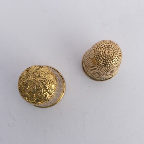 368 - A 9ct gold Thimble, with foliate engraved decoration, 20mm high, together with another unmarked in t... 