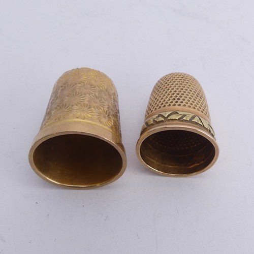 368 - A 9ct gold Thimble, with foliate engraved decoration, 20mm high, together with another unmarked in t... 