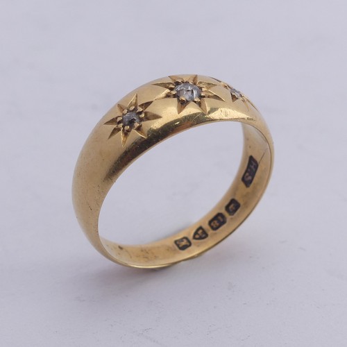 290 - An 18ct yellow gold Band, gypsy set with three graduated diamond points, Size M, 4g.... 