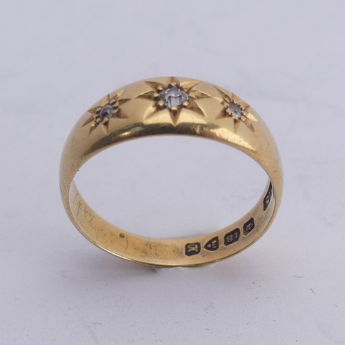 290 - An 18ct yellow gold Band, gypsy set with three graduated diamond points, Size M, 4g.... 